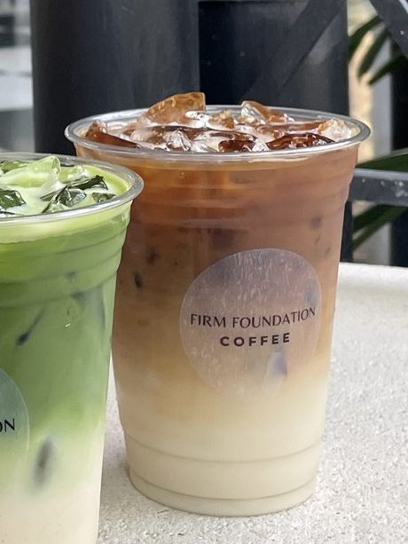 Layered iced espresso drink over ice
