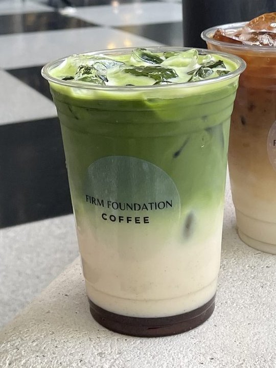 Iced matcha latte with layered green and cream